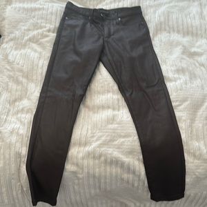 Plum coated skinny jeans.